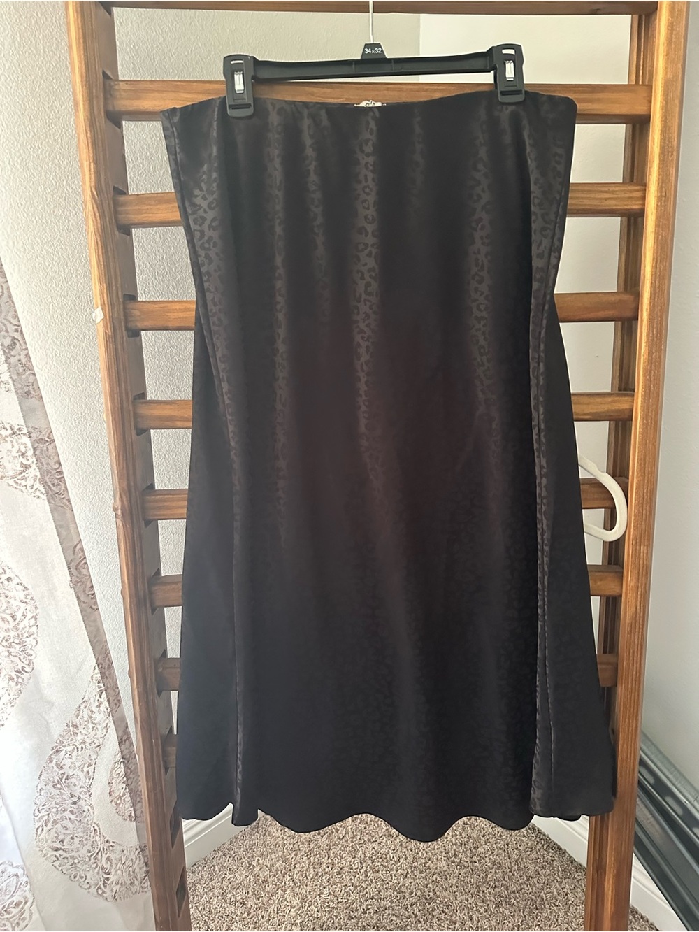 Sleek Black Satin A-Line Skirt with Subtle Leopard Pattern